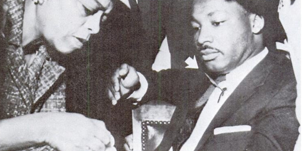 Martin Luther King, Jr receives first aid treatment after being stabbed in the chest