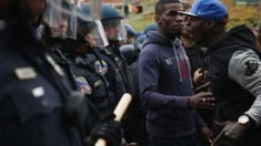 Baltimore protests: Wake for Freddie Gray after night of scuffles
