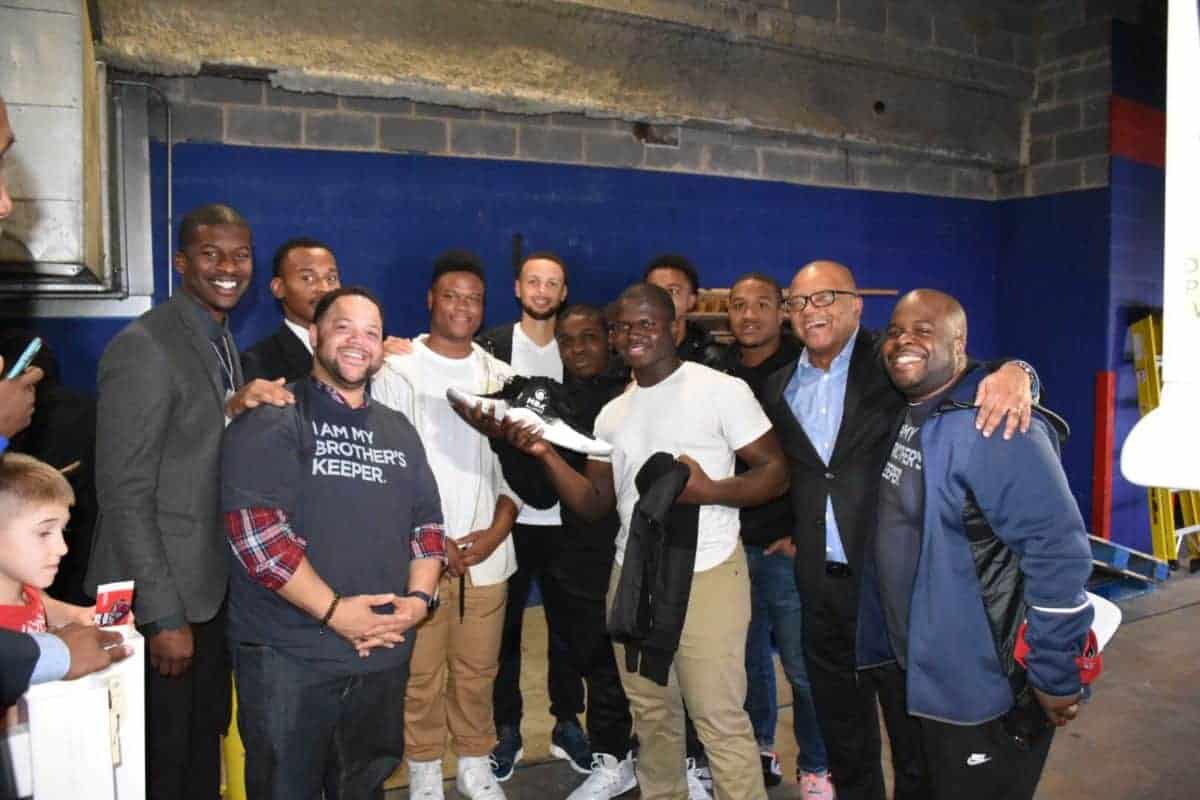 Steph Curry and staff of My Brother's Keeper. Courtesy of the Obama Foundation.