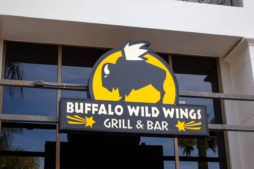 Huntington Beach, California/United States: 04/07/2019: A store front sign for the chicken wing sports restaurant known as Buffalo Wild Wings - Image