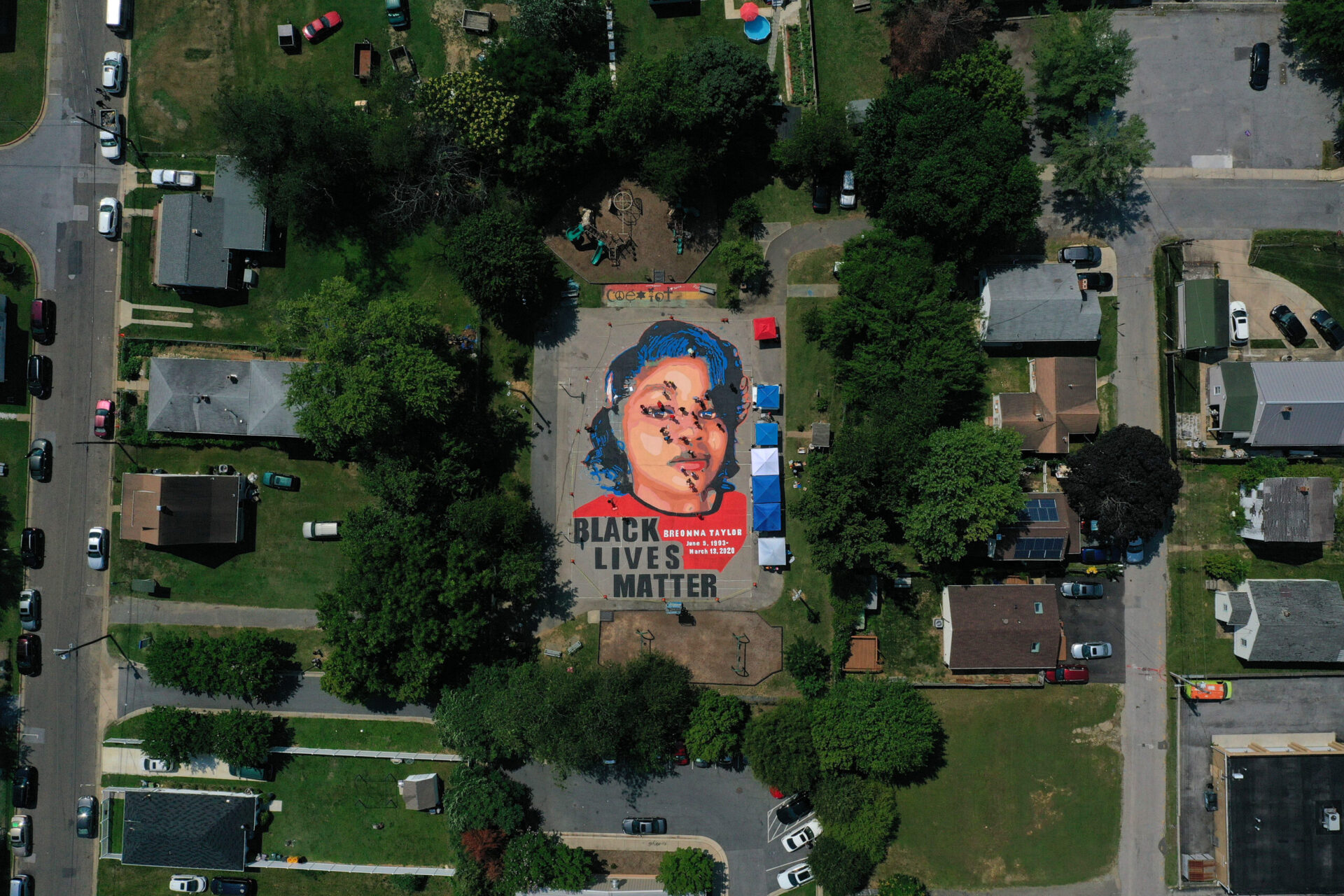 ANNAPOLIS, MARYLAND - JULY 05: In an aerial view from a drone, a large-scale ground mural depicting Breonna Taylor with the text 'Black Lives Matter' is seen being painted at Chambers Park on July 5, 2020 in Annapolis, Maryland. The mural was organized by Future History Now in partnership with Banneker-Douglass Museum and The Maryland Commission on African American History and Culture. The painting honors Breonna Taylor, who was shot and killed by members of the Louisville Metro Police Department in March 2020. (Photo by Patrick Smith/Getty Images)