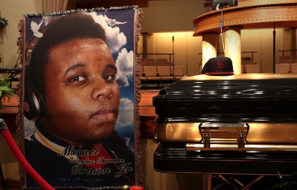 The casket of Michael Brown sits inside Friendly Temple Missionary Baptist Church awaiting the start of his funeral on August 25, 2014 in St. Louis Missouri. Michael Brown, an 18 year-old unarmed teenager, was shot and killed by a Ferguson Police Officer Darren Wilson in the nearby town of Ferguson, Missouri. His death caused several days of violent protests along with rioting and looting in Ferguson, MO. Image: Robert Cohen-Pool/Getty Images)