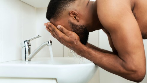 black_man_washing_face