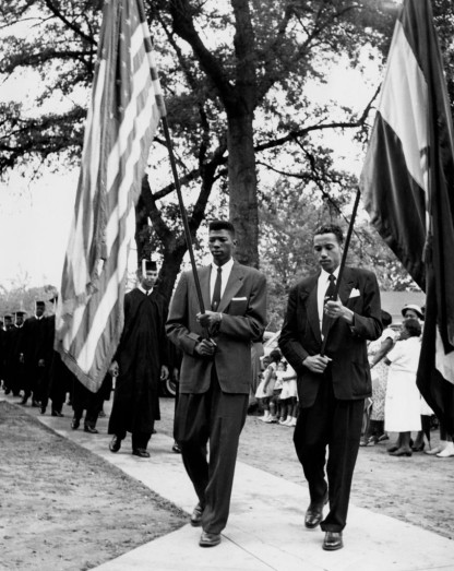 Leo Twiggs and Frank Reeder carry flags. (Photo by Cecil Williams/Claflin University/Historically Black Colleges and Universities via Getty Images)