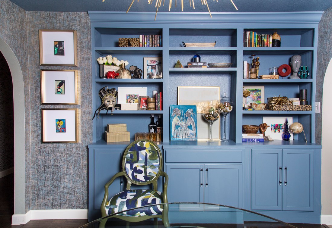Black-owned interior design firm's blue room featuring blue cabinets and unique details