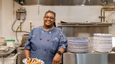 Black female chef Star Maye posing in kitchen