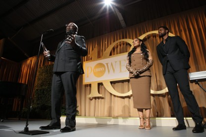 Target Corporation's Maurice Cooper accepts his award after an introduction from Garcelle Beauvais and Jay Ellis. Image: Antoine Debrill for EBONY Media.