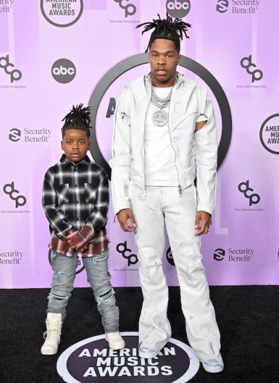 Lil Baby in an all white look and his son Jason Jones in a plaid shirt. Image: Axelle/Bauer-Griffin/FilmMagic for Getty Images