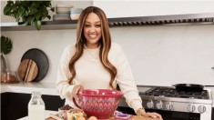 Tia Mowry posing with gift idea for best friend