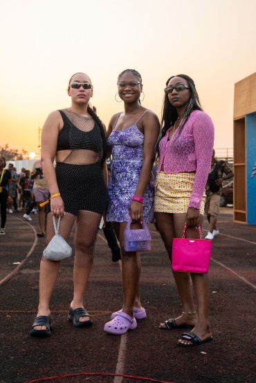 A stylish trio rock head-turning looks that embrace the art of layering and mixed prints at Afrochella 2022. Photo by Ernest Ankomah.