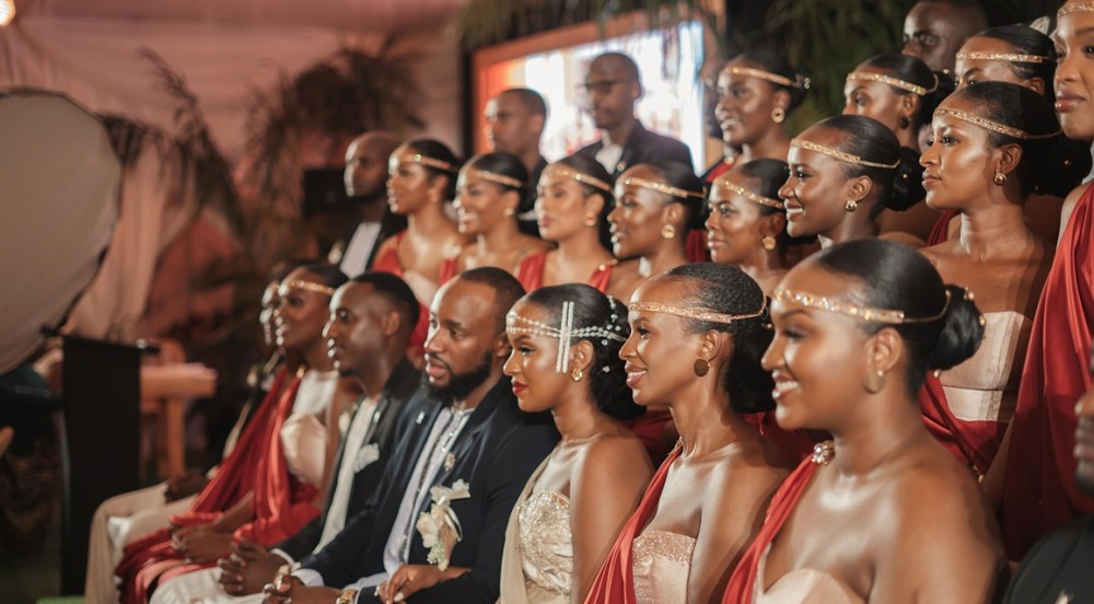 Lucy and Henry Mulira (center) with wedding party during Gusaba ceremony. Image: Paramount Images