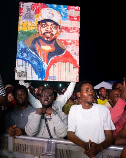 Fans showcase artwork featuring Chance the Rapper. Photo by Ernest Ankomah for EBONY Media.
