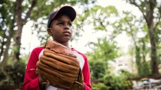 african american boy playing baseball