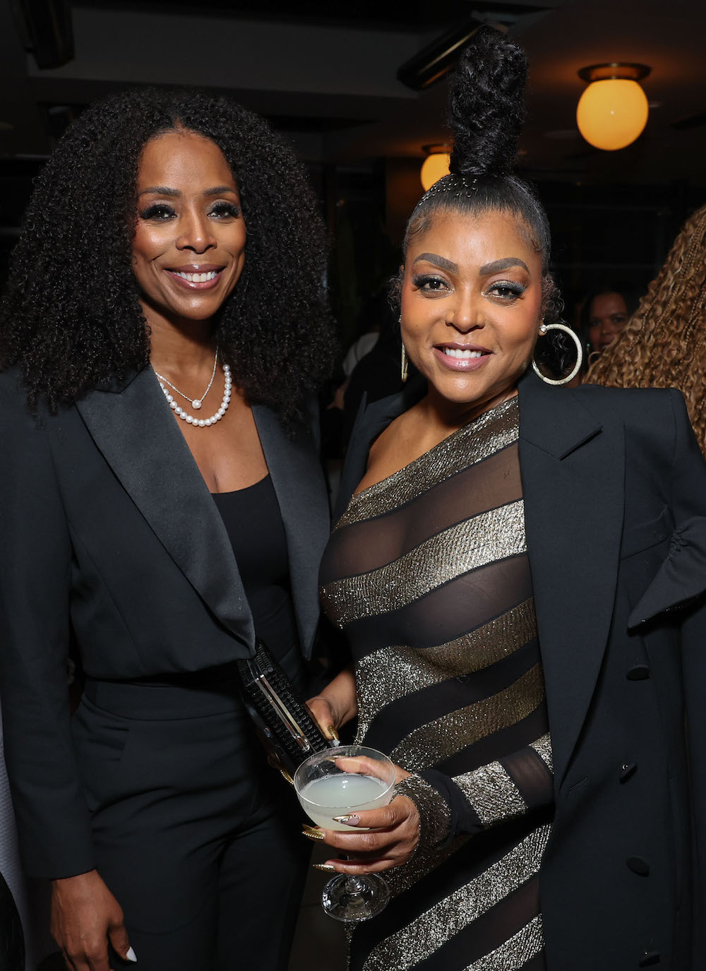 Tasha Smith (L) and Taraji P. Henson attend 2024 Celebration of Black Women in Entertainment dinner hosted by CAA Amplify. Image: Randy Shropshire/Getty Images for CAA.