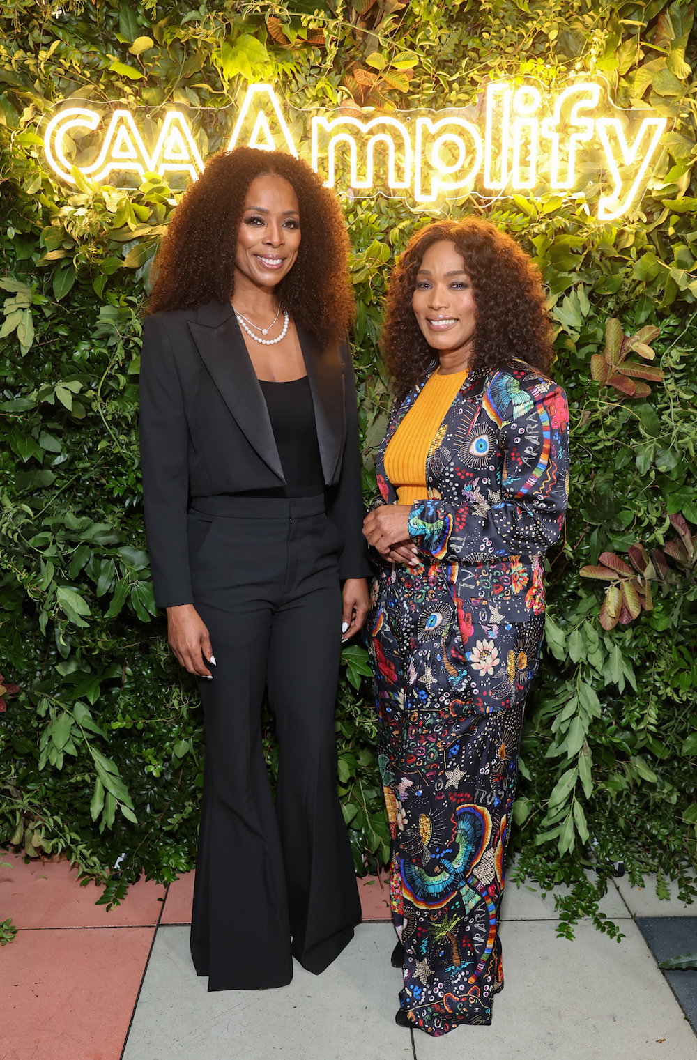 WEST HOLLYWOOD, CALIFORNIA - FEBRUARY 01: (L-R) Tasha Smith and Angela Bassett attend 2024 Celebration of Black Women in Entertainment hosted by CAA Amplify at Merois | West Hollywood on February 01, 2024 in West Hollywood, California. (Photo by Randy Shropshire/Getty Images for Creative Artists Agency )